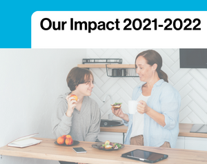 Image of a mother and son at home in kitchen, text reads 'our impact 2021-2022