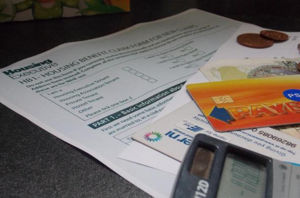 Image of housing benefit application form and electricity meter cards